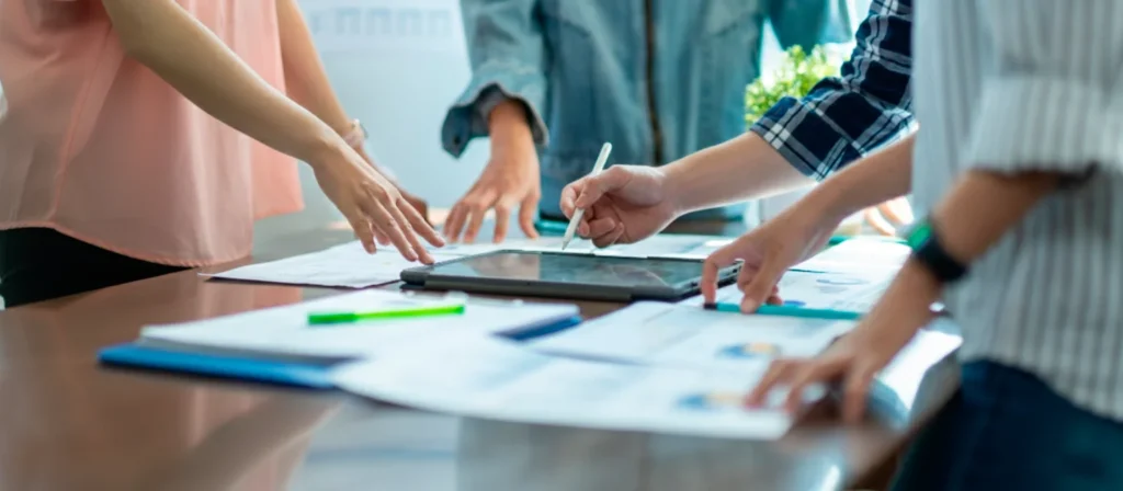 Collaborative biotech team analyzing data and optimizing processes